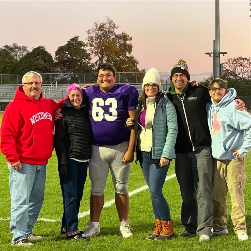 The Hemauer Family, including Brooks' parents, cheer #63 on at Northern football games.